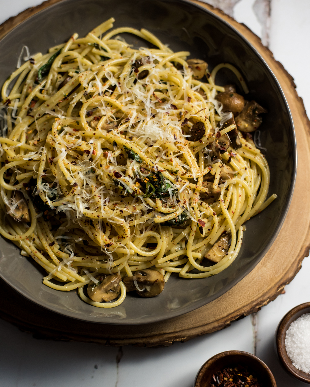 The sound of Spaghetti Aglio e Olio with Wilted Spinach and Mushrooms may sound intimidating, but this classic Italian dish with a twist, is super simple!
