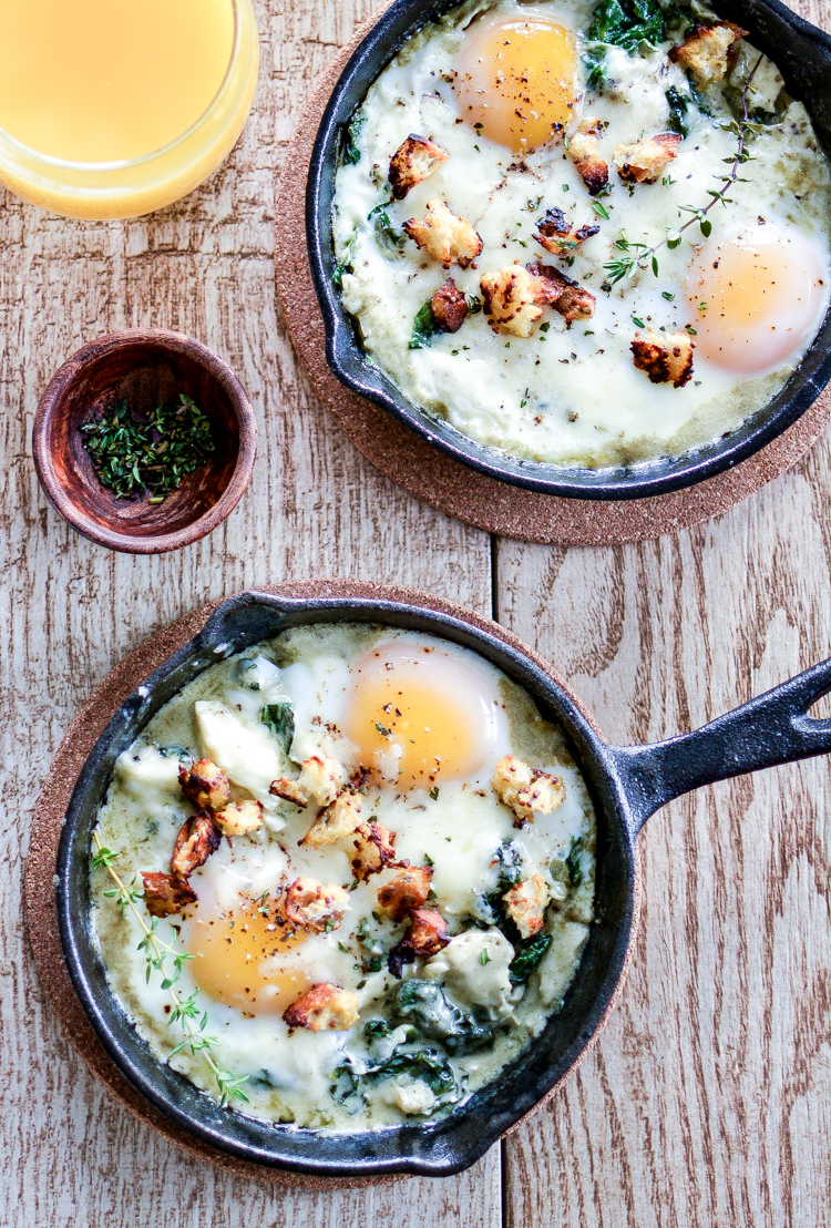 Baked eggs with creamed spinach is a fun way to enjoy breakfast or brunch! | www.cookingandbeer.com