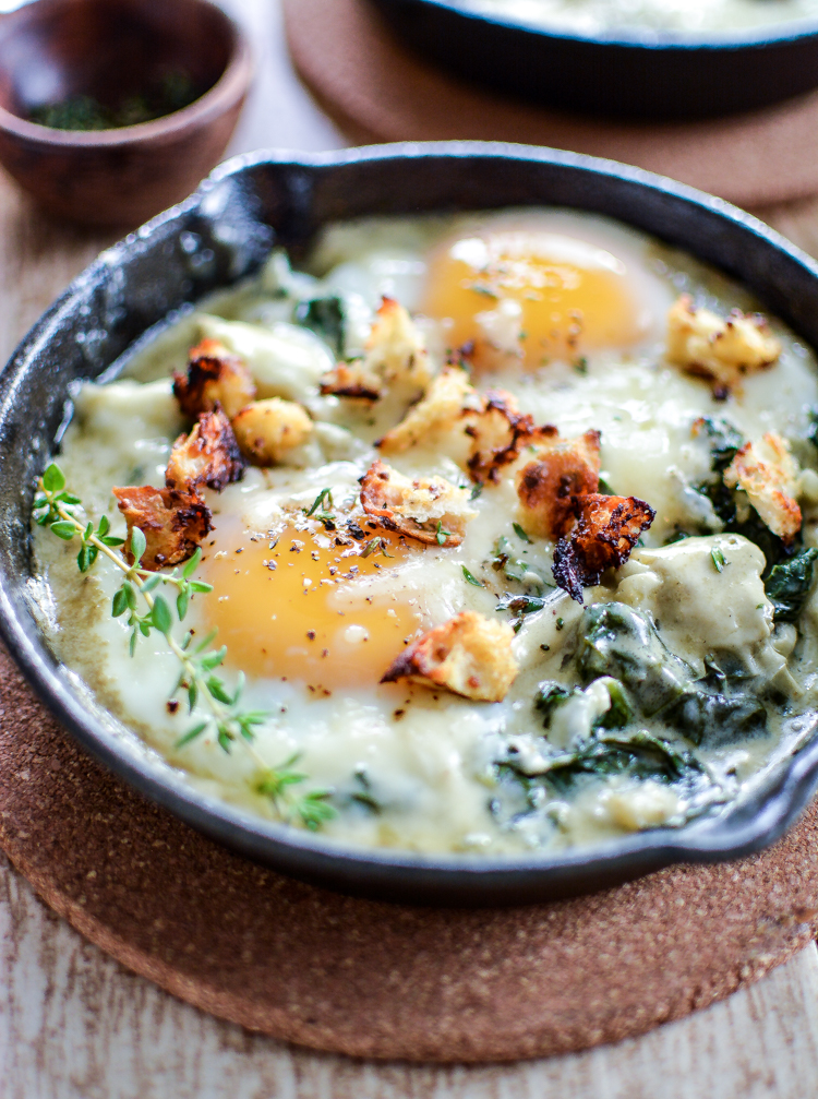 Baked eggs with creamed spinach is a fun way to enjoy breakfast or brunch! | www.cookingandbeer.com