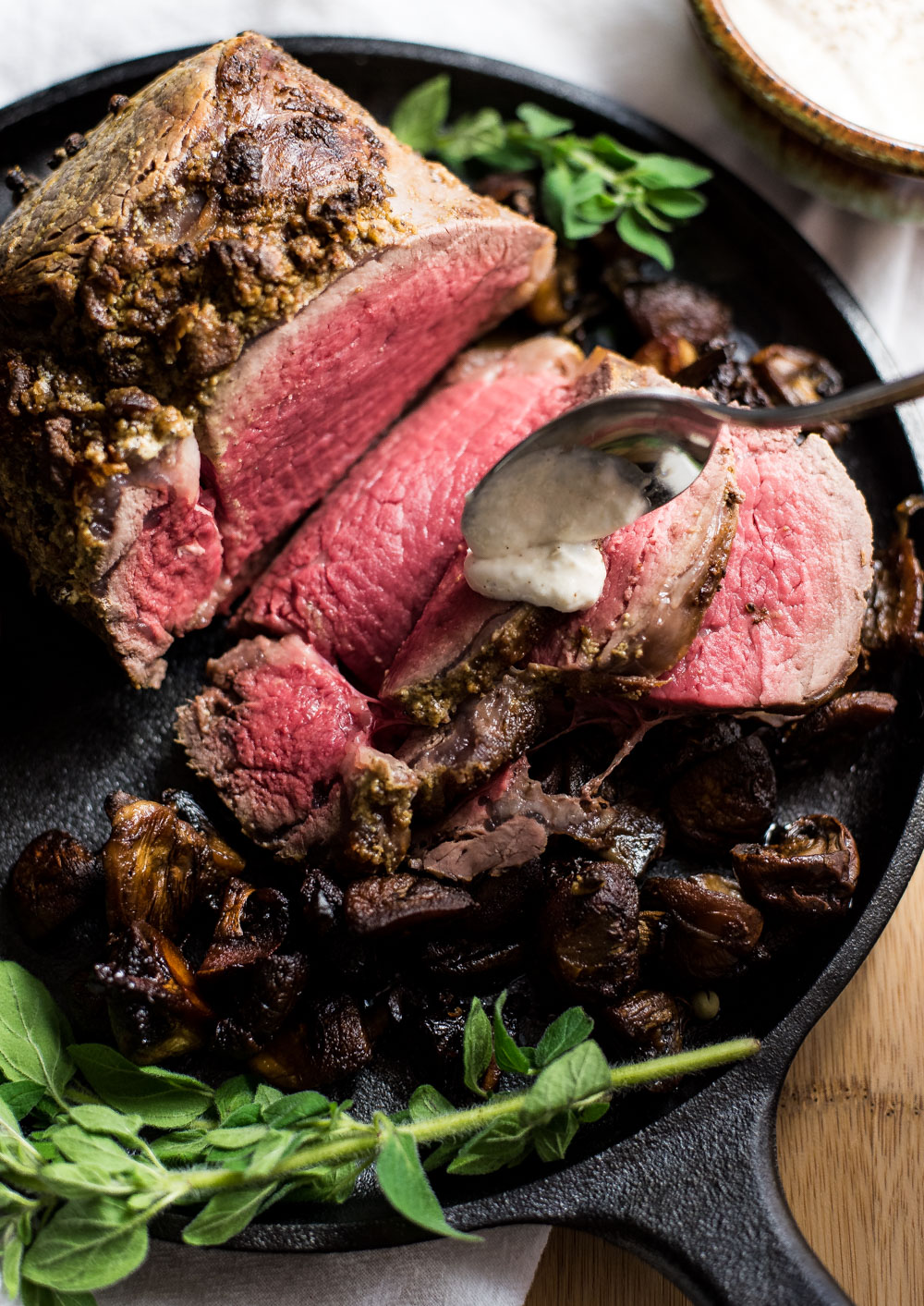 Here is a roasted beef tenderloin recipe like you've never seen before! It's adorned with pilsner mushrooms and the perfect beer horseradish sauce!