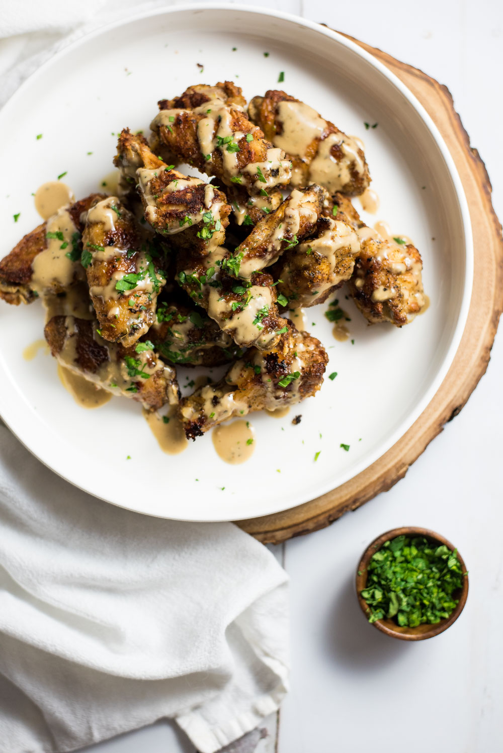 Crispy Asiago Caesar Chicken Wings are the perfect addition to your game day menus. They are baked, not fried and full of deliciousness!