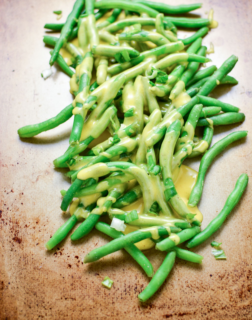 Garlic Butter Green Beans with Tarragon Cheddar Cheese Sauce are the perfect simple yet delicious side dish recipe for your Easter or Mother's Day spreads!