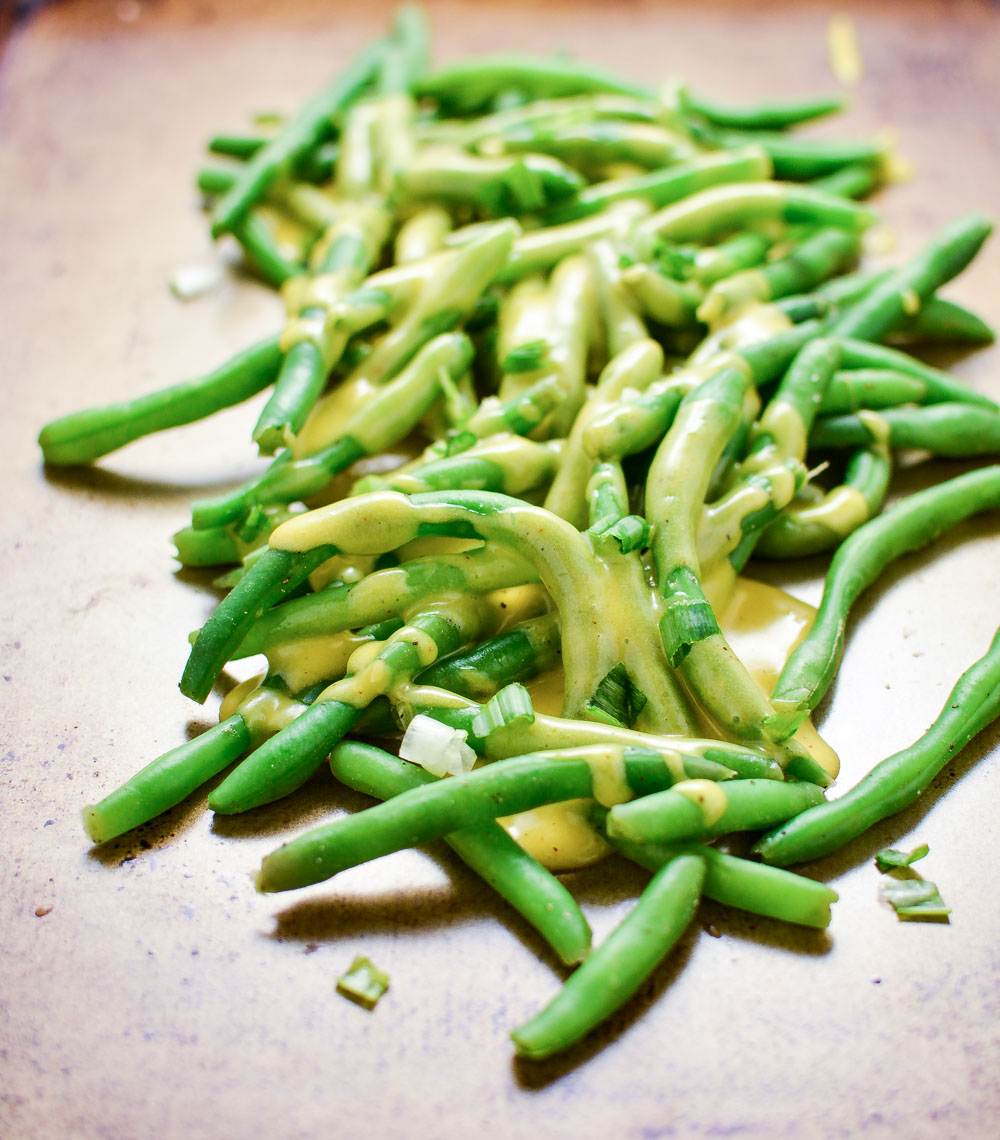 Garlic Butter Green Beans with Tarragon Cheddar Cheese Sauce are the perfect simple yet delicious side dish recipe for your Easter or Mother's Day spreads!
