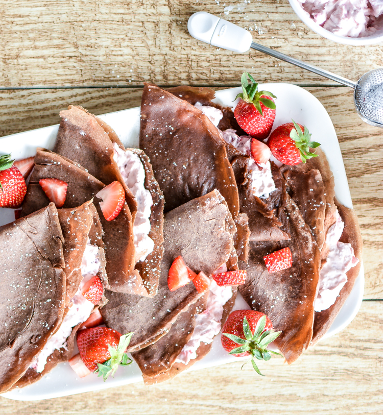 Strawberry Cheesecake Chocolate Crepes are an easy brunch/dessert recipe that celebrates strawberry season! | www.cookingandbeer.com