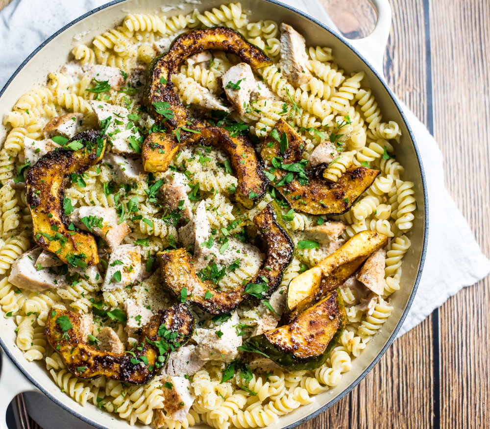 Chicken alfredo pasta with caramelized acorn squash is the perfect fall spin on traditional chicken alfredo. It's one big bowl of comfort!