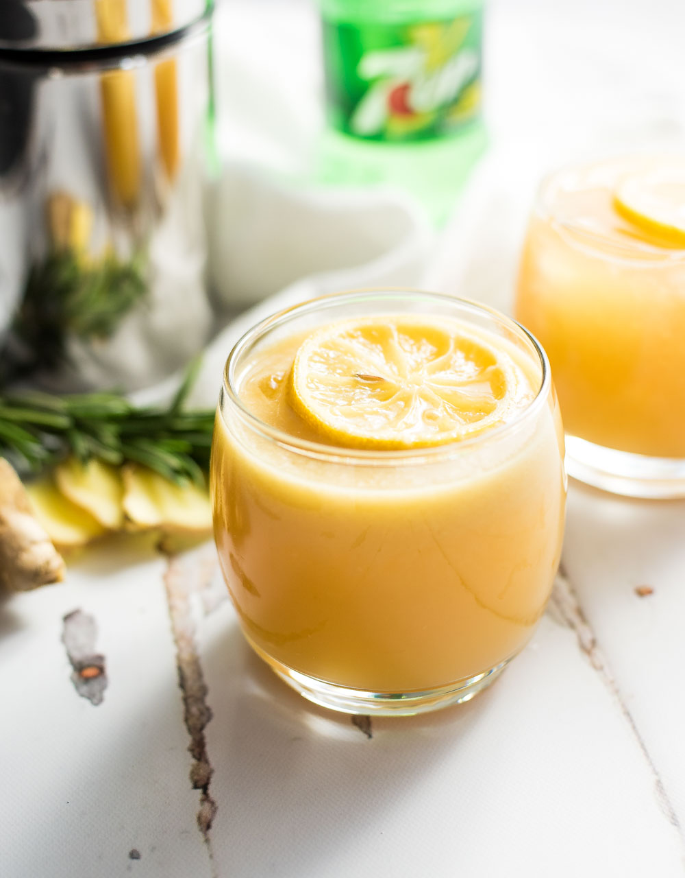 Citrus ginger beer cocktail with candied lemon slices is the perfect drink using 7UP®, fresh ginger, and freshly squeezed orange juice! It is kicked up a notch with both bourbon and pale ale beer creating a flavor explosion!