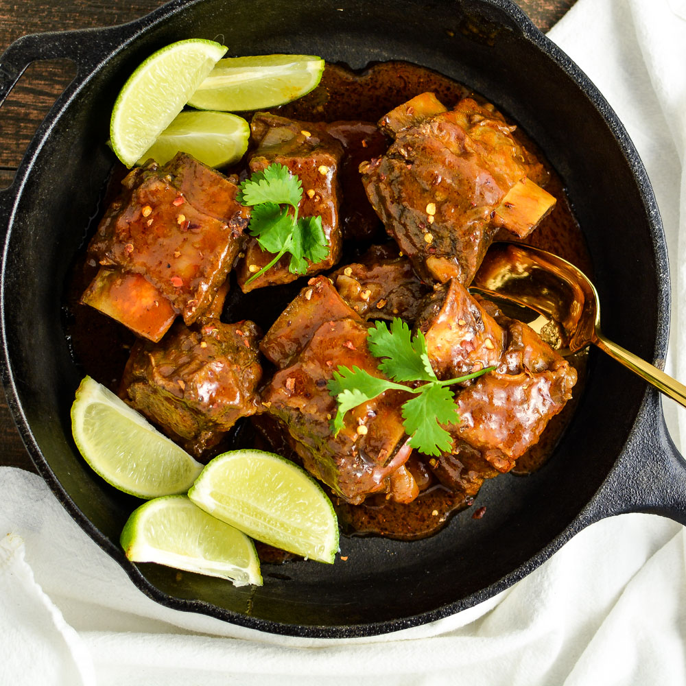 Citrus and Chili Braised Beef Short Ribs are tender, spicy and so full of deliciousness. They are the perfect Sunday supper recipe!