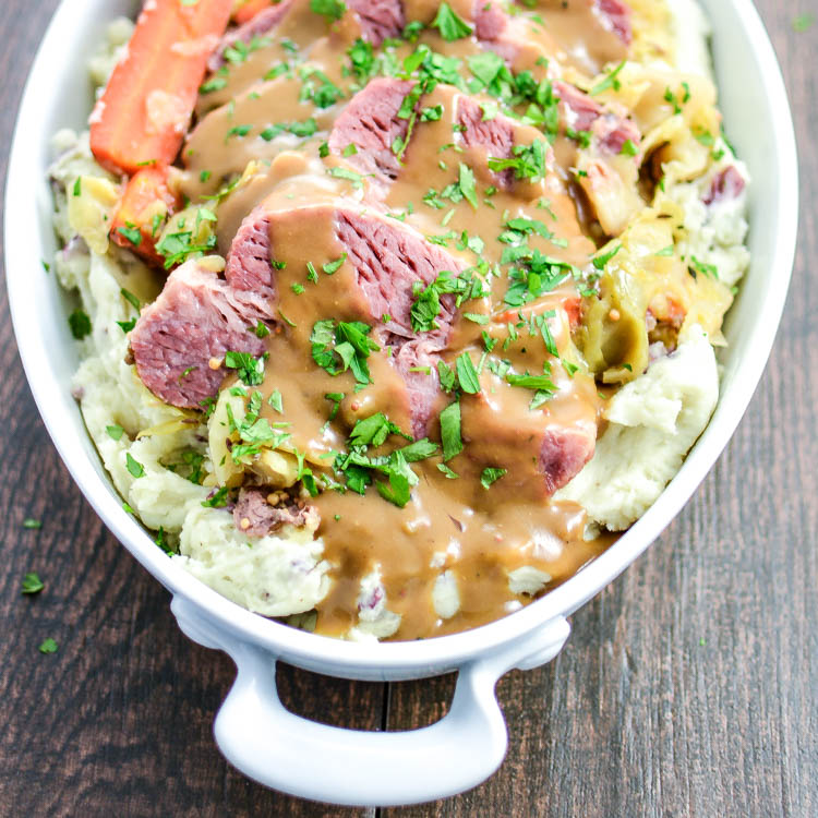 Slow Cooker Corned Beef and Cabbage with Mashed Red Potatoes and Dijon Stout Gravy is the perfect Irish meal to get you through St. Patrick's Day! | www.cookingandbeer.com