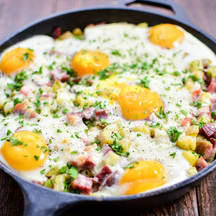 A St. Patrick's Day must-have: Corned Beef Hash Baked Eggs with Cheese recipe is perfect for breakfast or dinner!  | www.cookingandbeer.com
