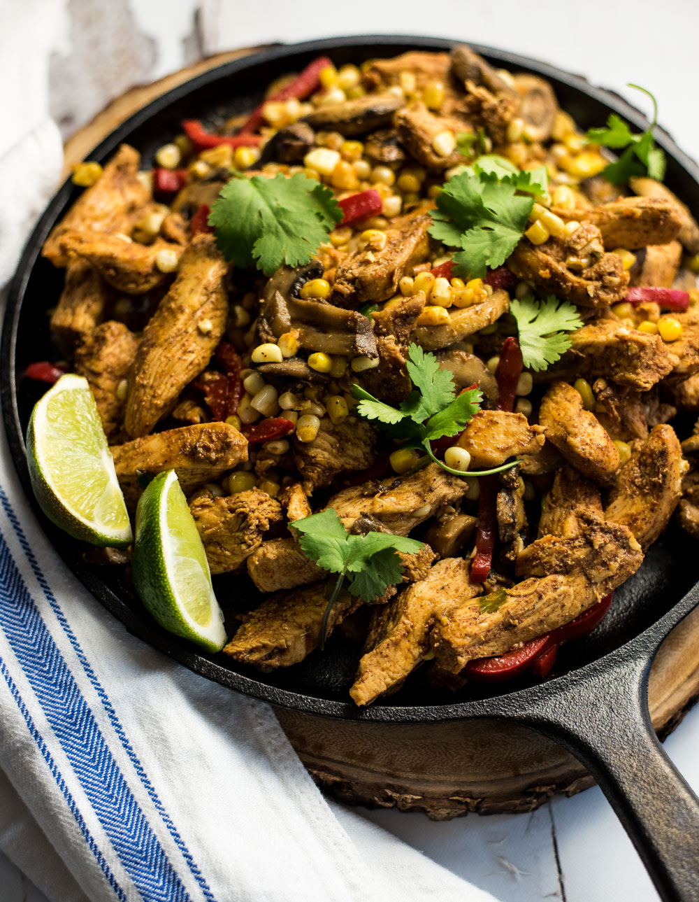 These spicy corn and chicken fajitas are bursting with bold flavors. They are on the table in under an hour and are the perfect weeknight meal!