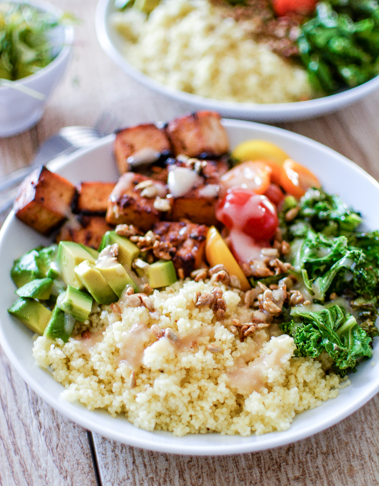 Kale and Couscous Tofu Bowls with Orange Tahini Dressing is a weeknight dinner recipe that is super hearty, filling and packs a lot of flavor! | www.cookingandbeer.com