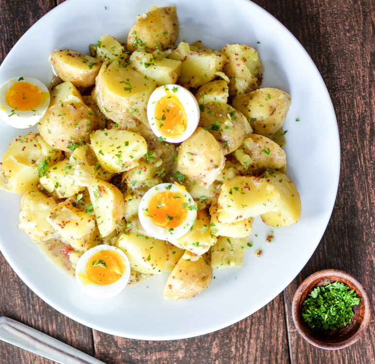 Potato Salad with Soft-Boiled Eggs and Maple Mustard Dressing is a summer picnic recipe that you need to add to your recipe box! | www.cookingandbeer.com