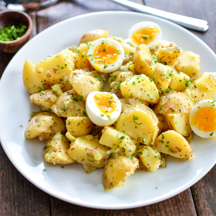 Potato Salad with Soft-Boiled Eggs and Maple Mustard Dressing is a summer picnic recipe that you need to add to your recipe box! | www.cookingandbeer.com