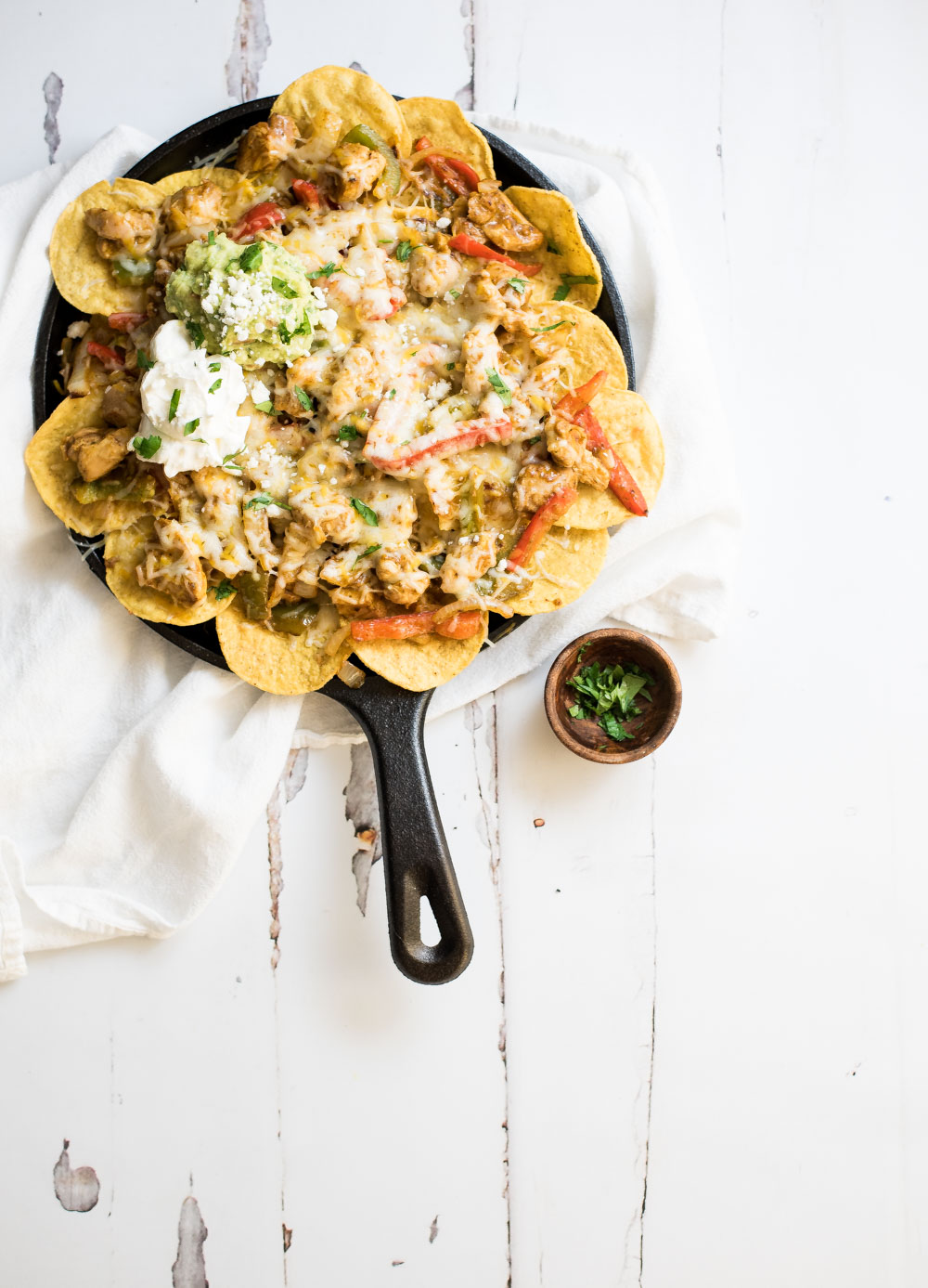 You can quickly elevate nachos with a few simple ingredient substitutions. These chicken fajita nachos are perfect for game day and are the perfect bites!