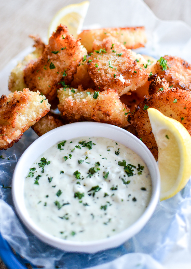 Recipe for Crispy Oven-Fried Fish Bites with Homemade Tartar Sauce is a quick weeknight meal that is kid friendly and so much better than the frozen stuff! | www.cookingandbeer.com