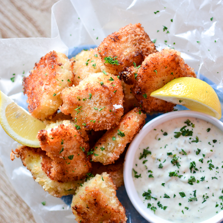 Recipe for Crispy Oven-Fried Fish Bites with Homemade Tartar Sauce is a quick weeknight meal that is kid friendly and so much better than the frozen stuff! | www.cookingandbeer.com