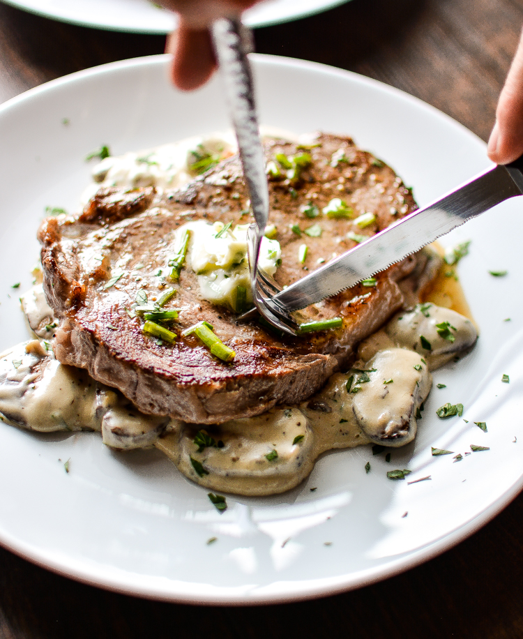 Grilled Ribeye Steak with Herb Butter and Creamy Mushrooms is a hearty, comforting and delicious weekend grilling recipe! | www.cookingandbeer.com