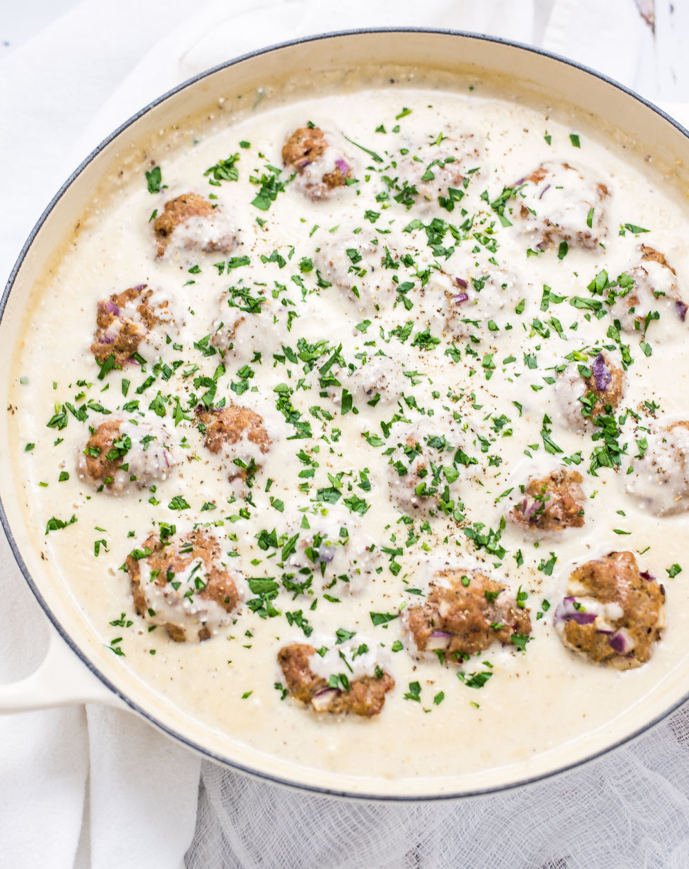 Light Almond Chicken Meatballs in Cauliflower Cream Sauce is a family-friendly weeknight meal that packs a lot of flavor, yet stays on the lighter side!