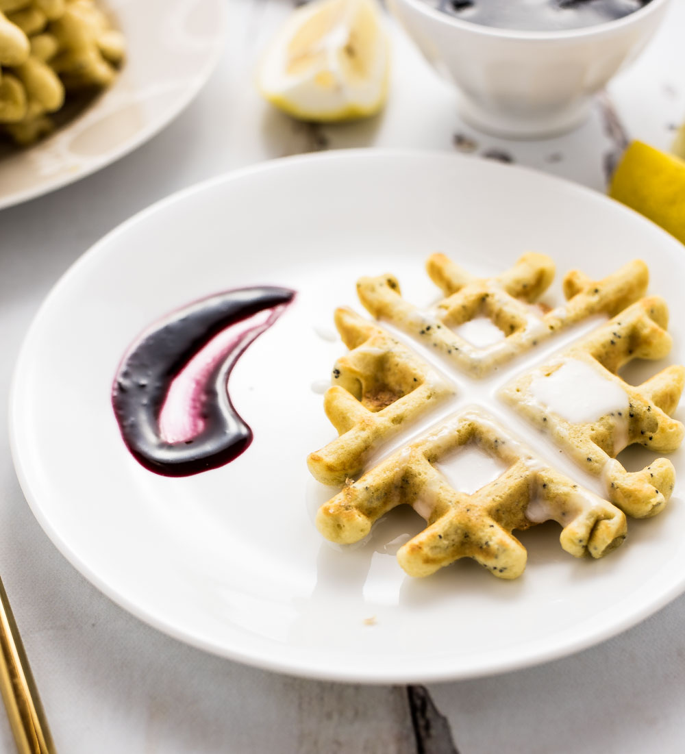 Start your day with these Lemon Poppy Seed Waffles with Blueberry Sauce! They will be a crowd pleaser at any breakfast or brunch gathering!