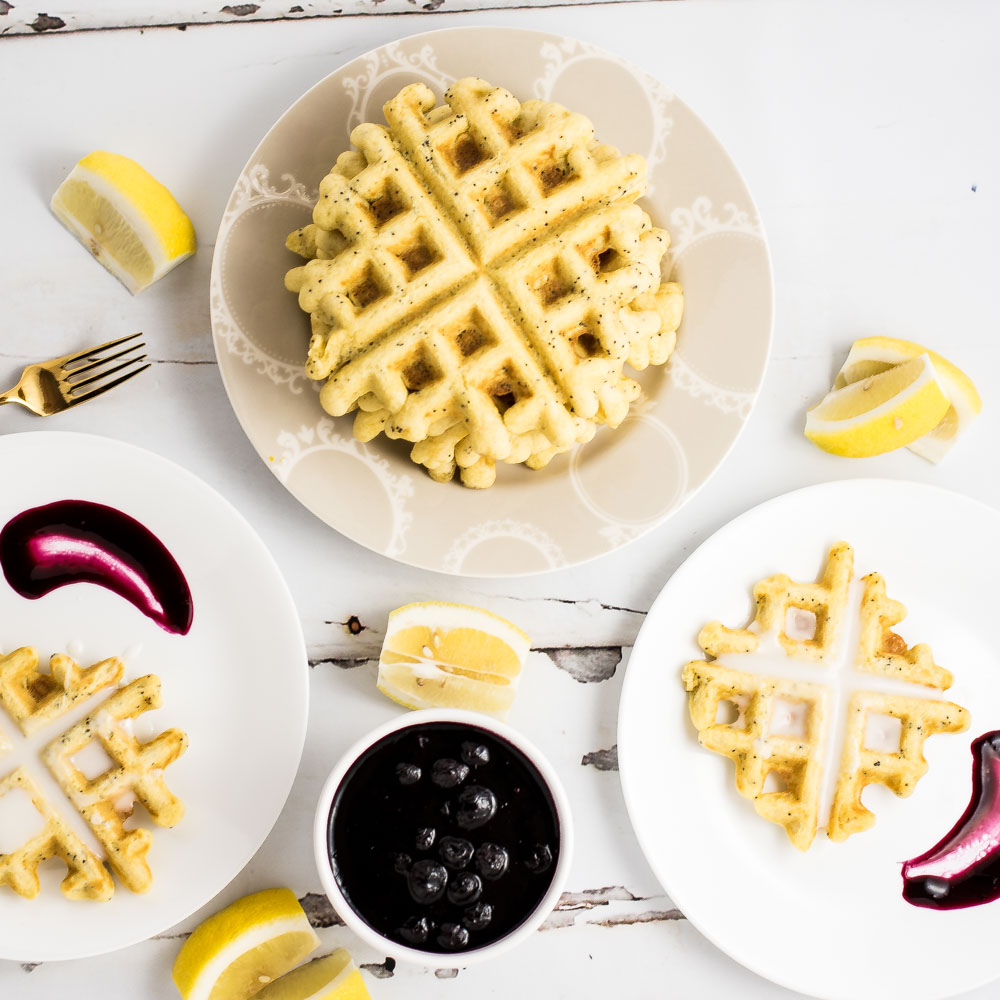 Start your day with these Lemon Poppy Seed Waffles with Blueberry Sauce! They will be a crowd pleaser at any breakfast or brunch gathering!