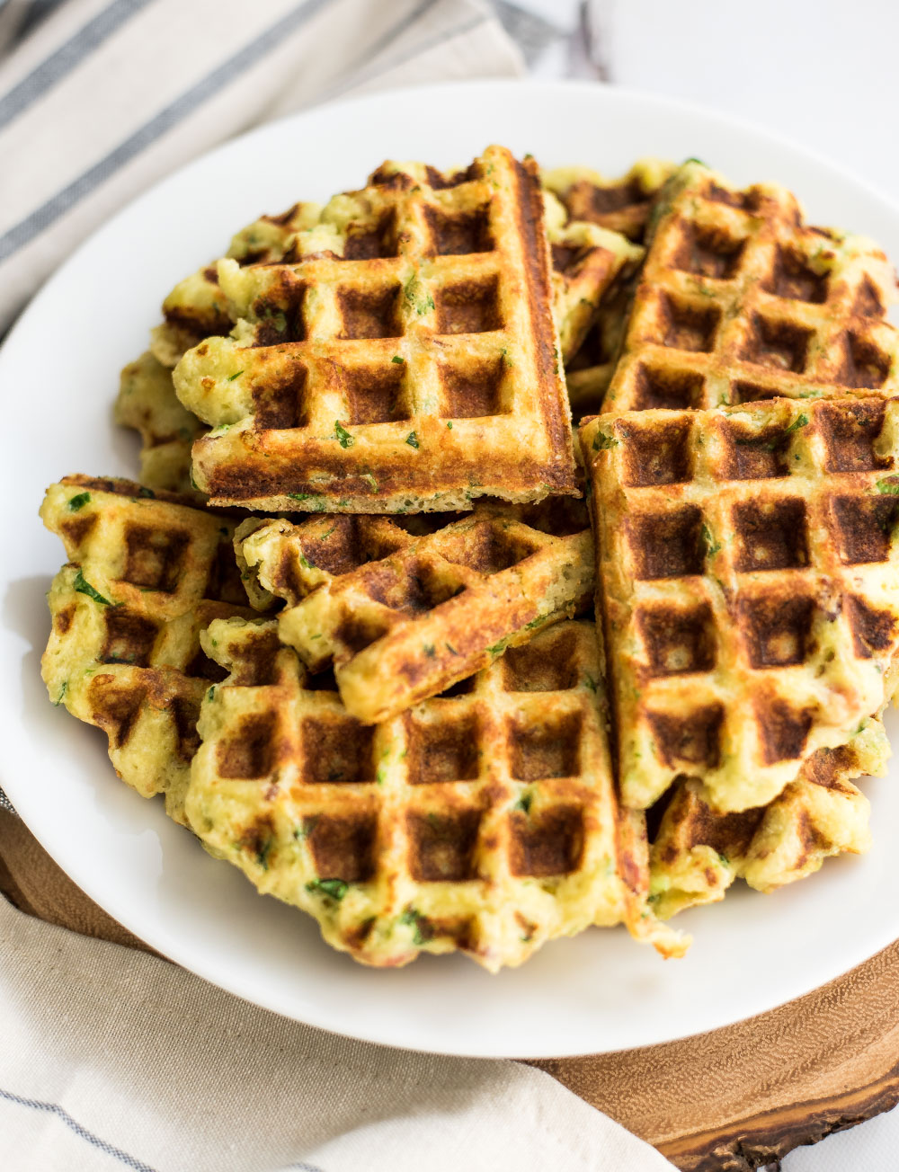 Goat cheese and spinach mashed potato waffles are a great way to use leftover mashed potatoes. They make a great side dish or bite-sized snack!