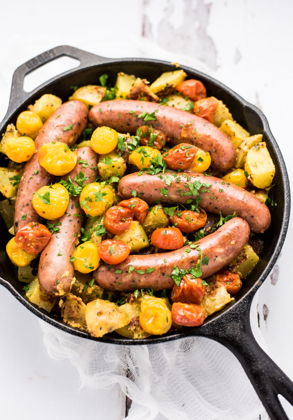 One Pan Roasted Chicken Sausage and Mustard Potatoes is the perfect weeknight meal, adorned with blistered tomatoes and a ton of flavor!