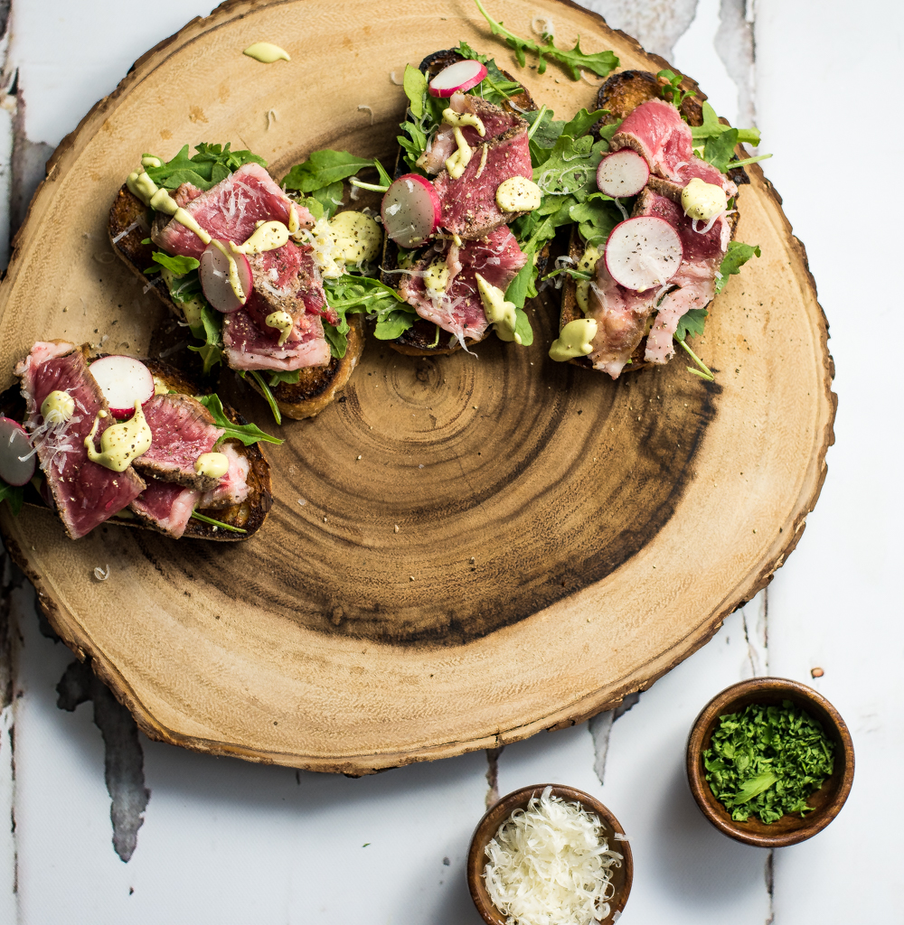 Open-Faced Steak Sandwiches with Parmesan Avocado Cream are the perfect appetizer or quick lunch recipe. Serve them at your next get together!