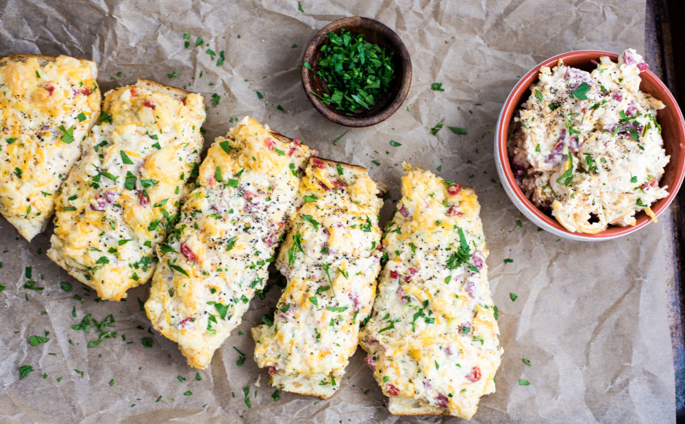 Pimento Cheese French Bread is a fun way to bring more pimento cheese in your life! It is the perfect appetizer or snack!