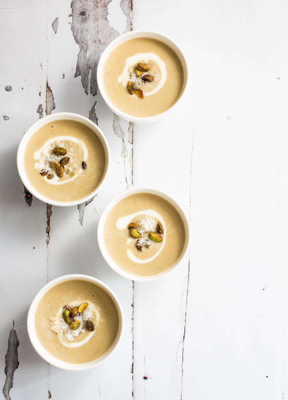Soup isn't just for the wintertime. This creamy spring cauliflower and pistachio soup is just bursting with bright spring and summer flavors!