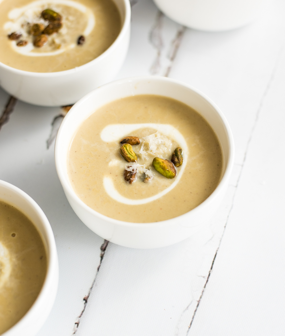 Soup isn't just for the wintertime. This creamy spring cauliflower and pistachio soup is just bursting with bright spring and summer flavors!