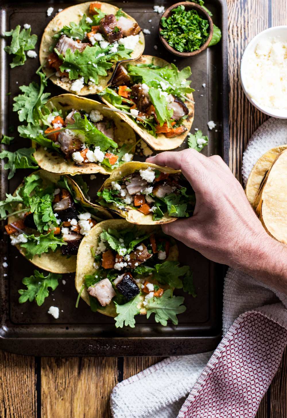Take your taco Tuesday up a notch, and make these braised pork belly and sweet potato tacos! Crispy, tender pork belly really makes these tacos shine!