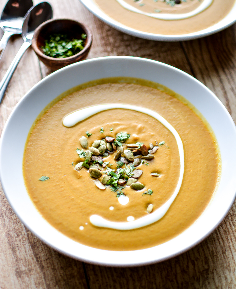 Serve this Slow Cooker Spicy and Creamy Pumpkin Soup this autumn! It's creamy, healthy, spicy...and with a dash of curry, is taken it to a whole new level!