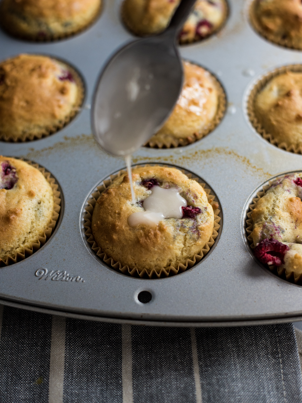 Meyer lemon raspberry vanilla muffins with chamomile glaze are the perfect recipe to whip up on Sunday morning. They are bursting with flavor!