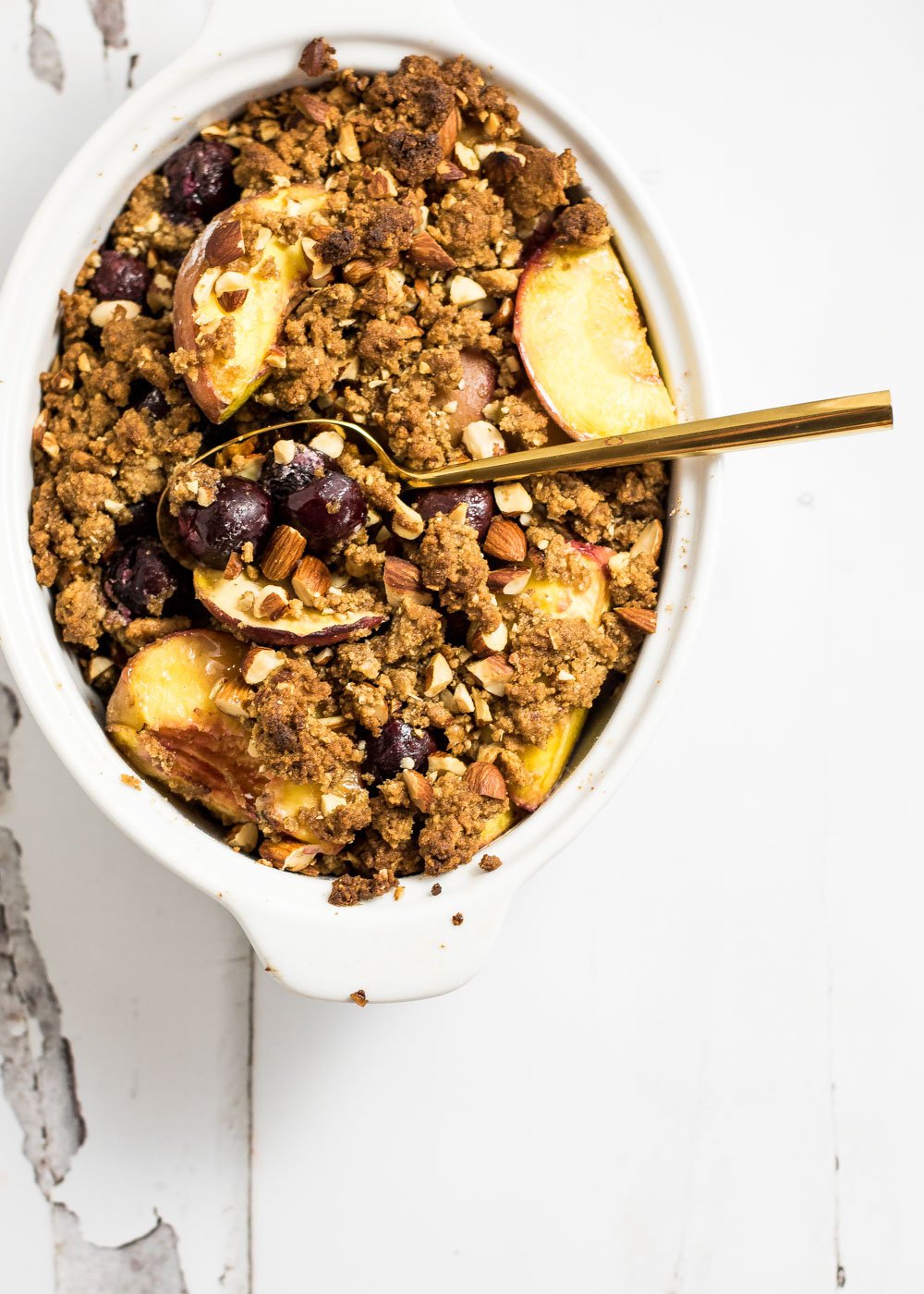 Roasted peaches and sweet cherries with graham cracker crumble is the perfect bright summer dessert that highlight fresh summer fruit!