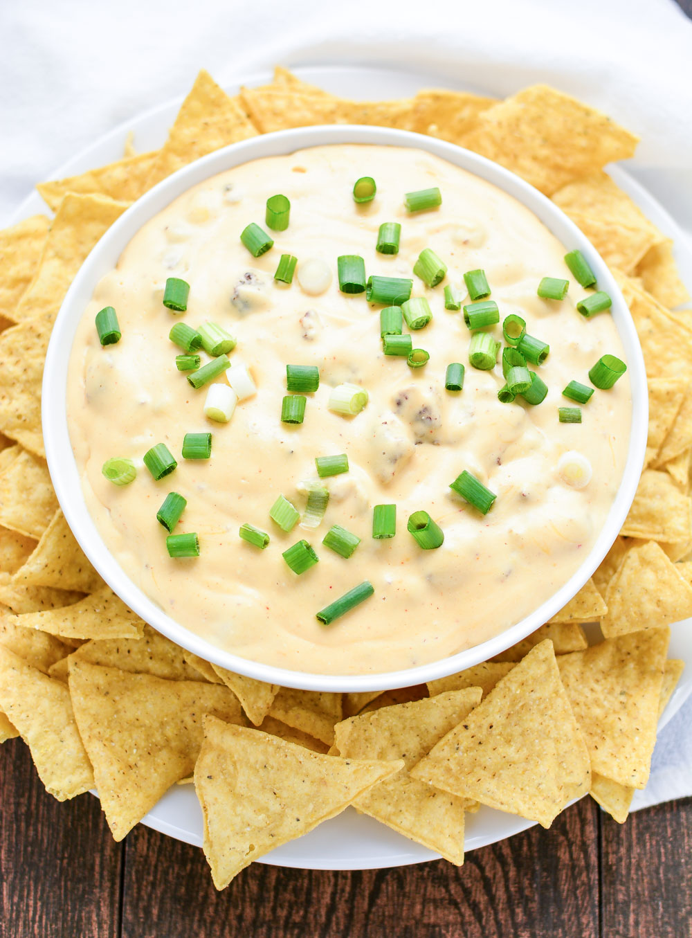 Slow Cooker Spicy Sausage Cheese Dip is the perfect game day recipe highlighting savory ground pork sausage, tons of cheese, and spices to compliment!