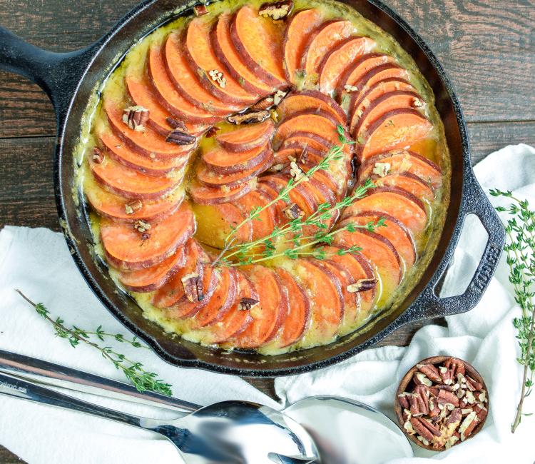 Skillet Scalloped Sweet Potatoes with Maple Bourbon Brown Butter is a must-have side dish recipe for your Thanksgiving Day dinner spreads.