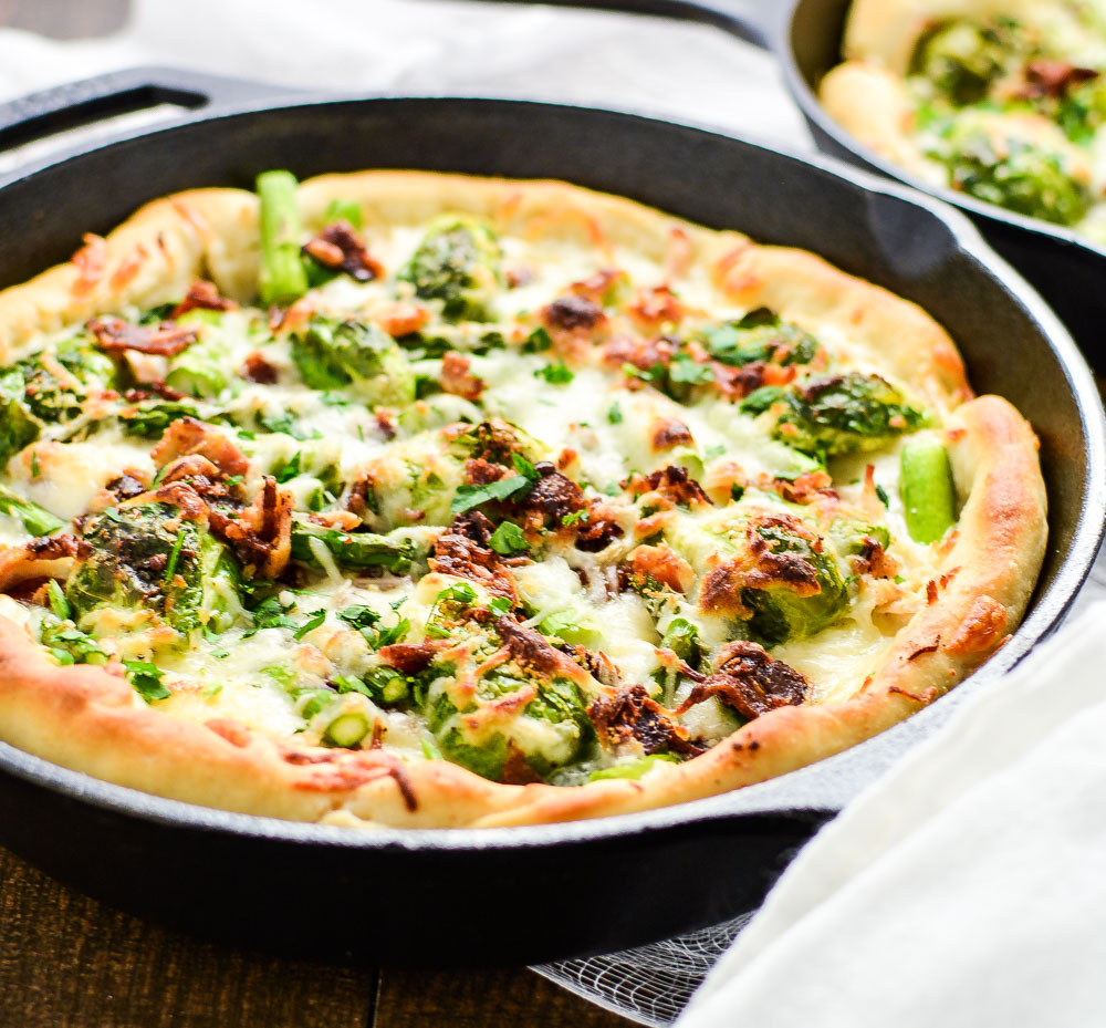 Spring Vegetable White Skillet Pizza is the perfect Friday night dinner recipe highlighting fresh spring flavors!