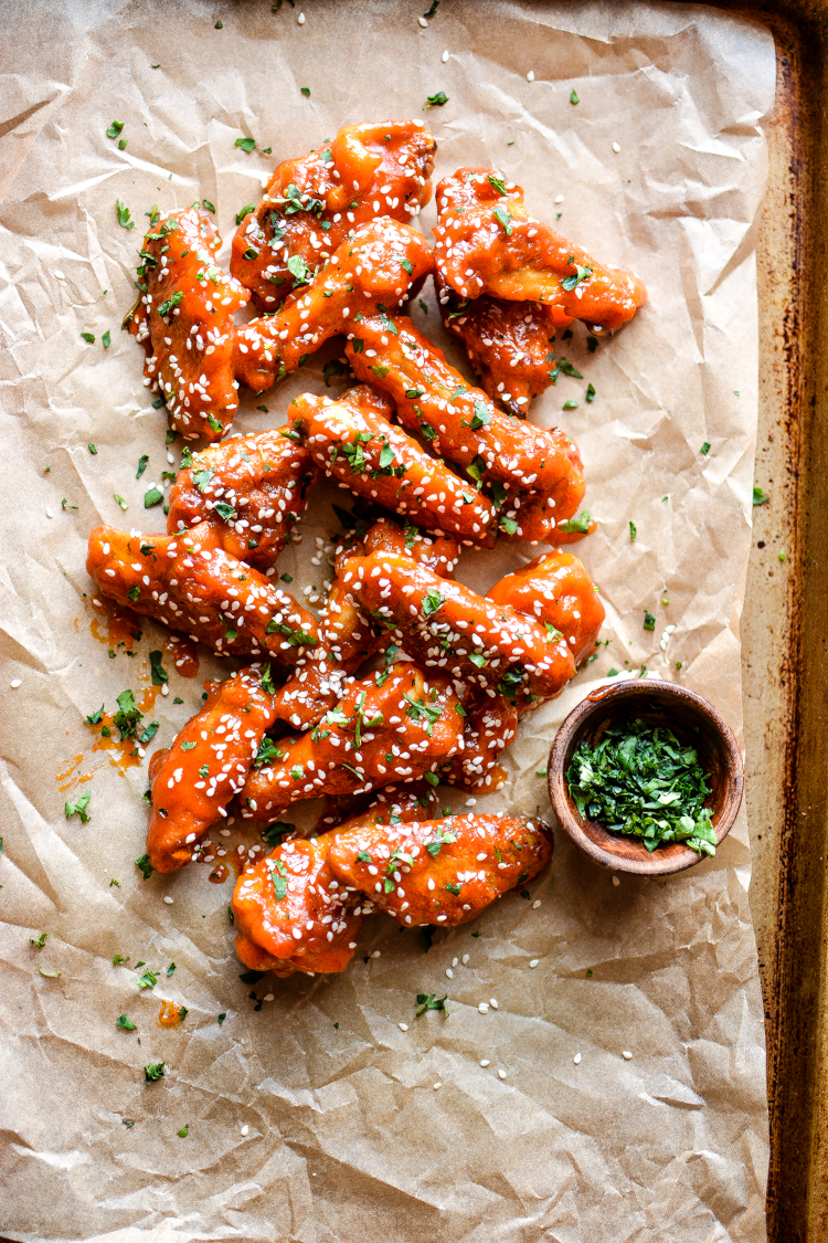 With football season right around the corner, these sriracha honey chicken wings are the perfect addition to your game day menu! | www.cookingandbeer.com