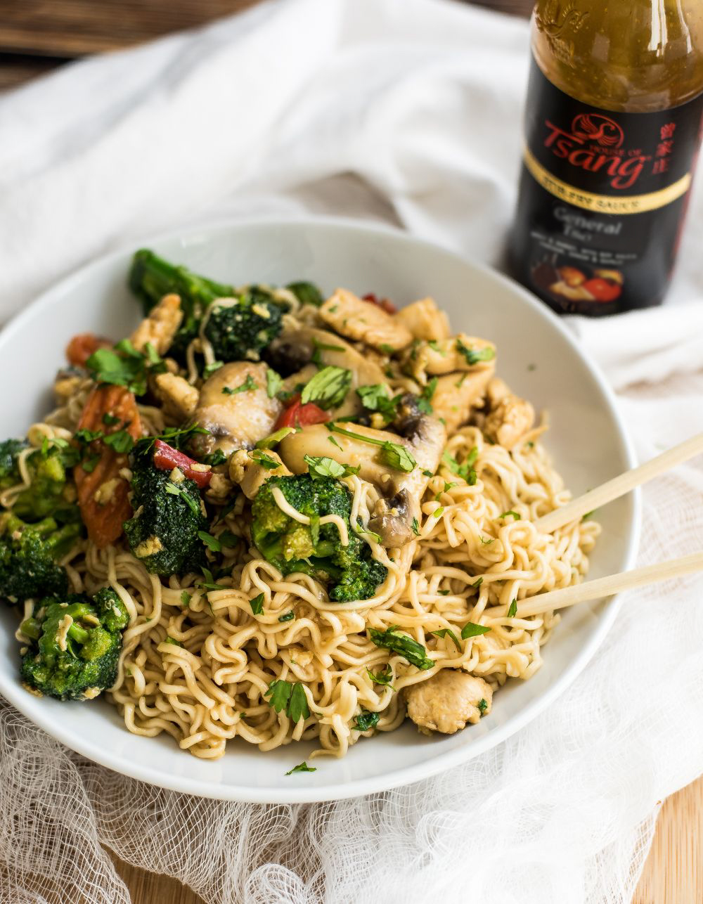 30-Minute Chicken Stir Fry Ramen is the perfect family-friendly weeknight meal. It is on the table in 30 minutes and is exploding with flavor thanks to House of Tsang's General Tso Stir-Fry Sauce!