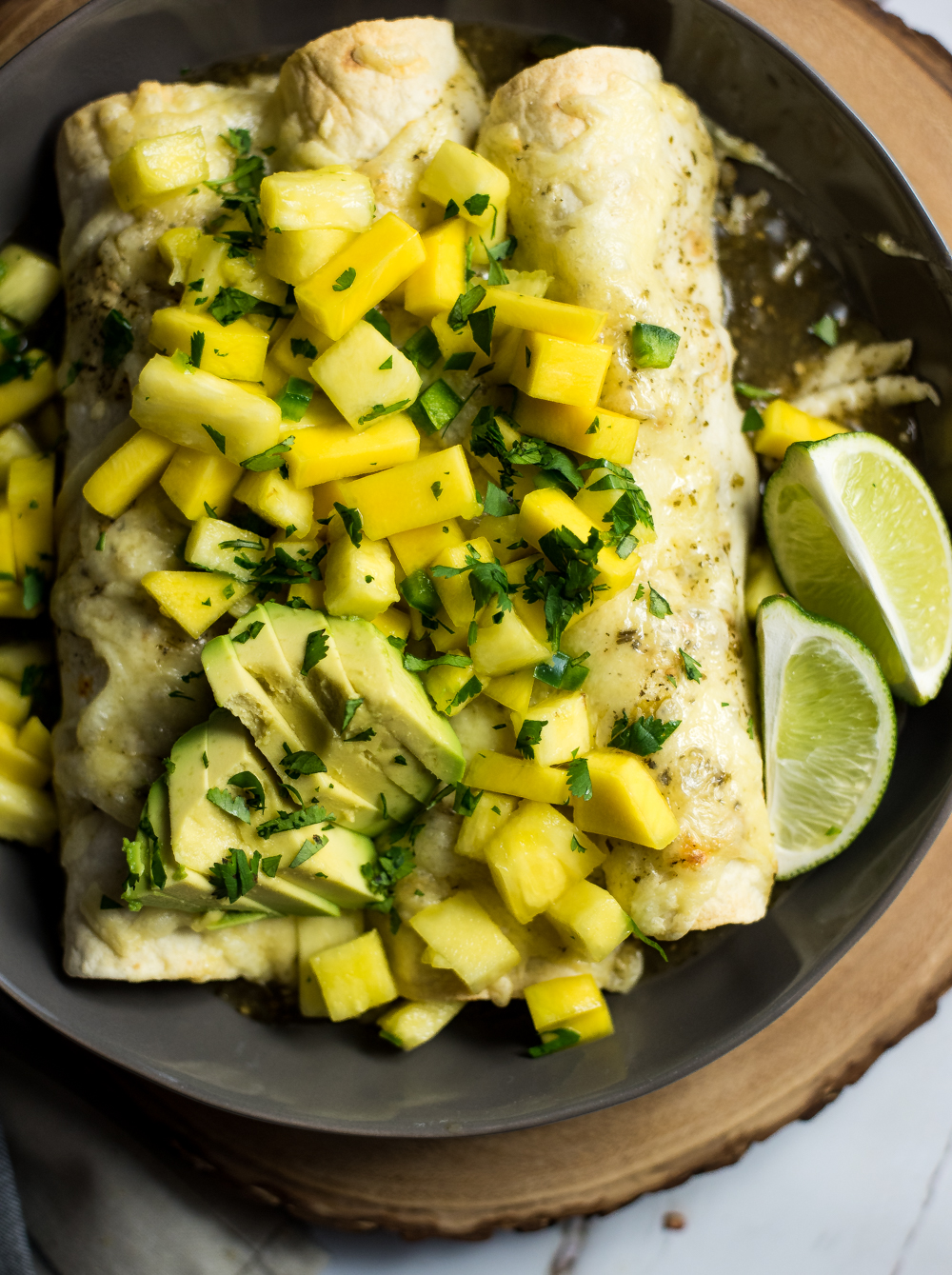 Take your enchiladas to the next level and make these tropical chipotle chicken enchiladas with mango salsa. They will be a hit at the dinner table!